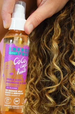 Huile coiffante anti-fourche pour cheveux bouclés